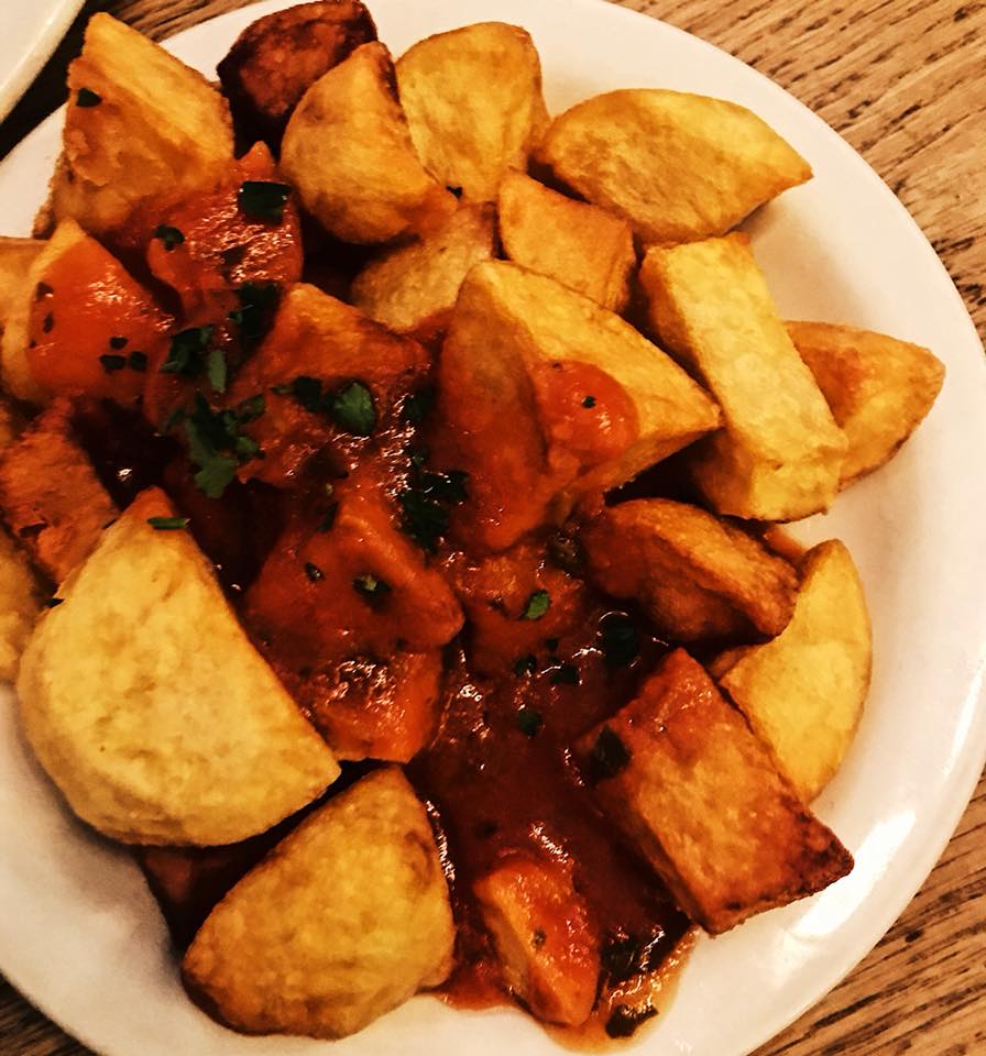 Fried potatoes with a spicy tomato sauce G.F