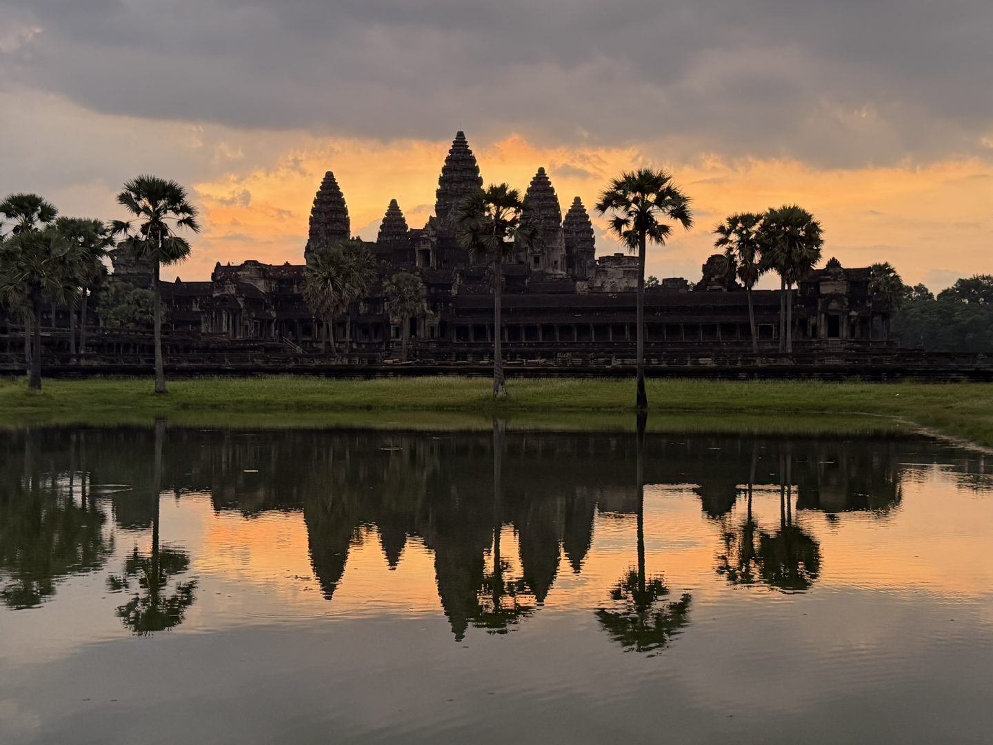 Angkor Wat reflected in the water at sunrise in Siem Reap