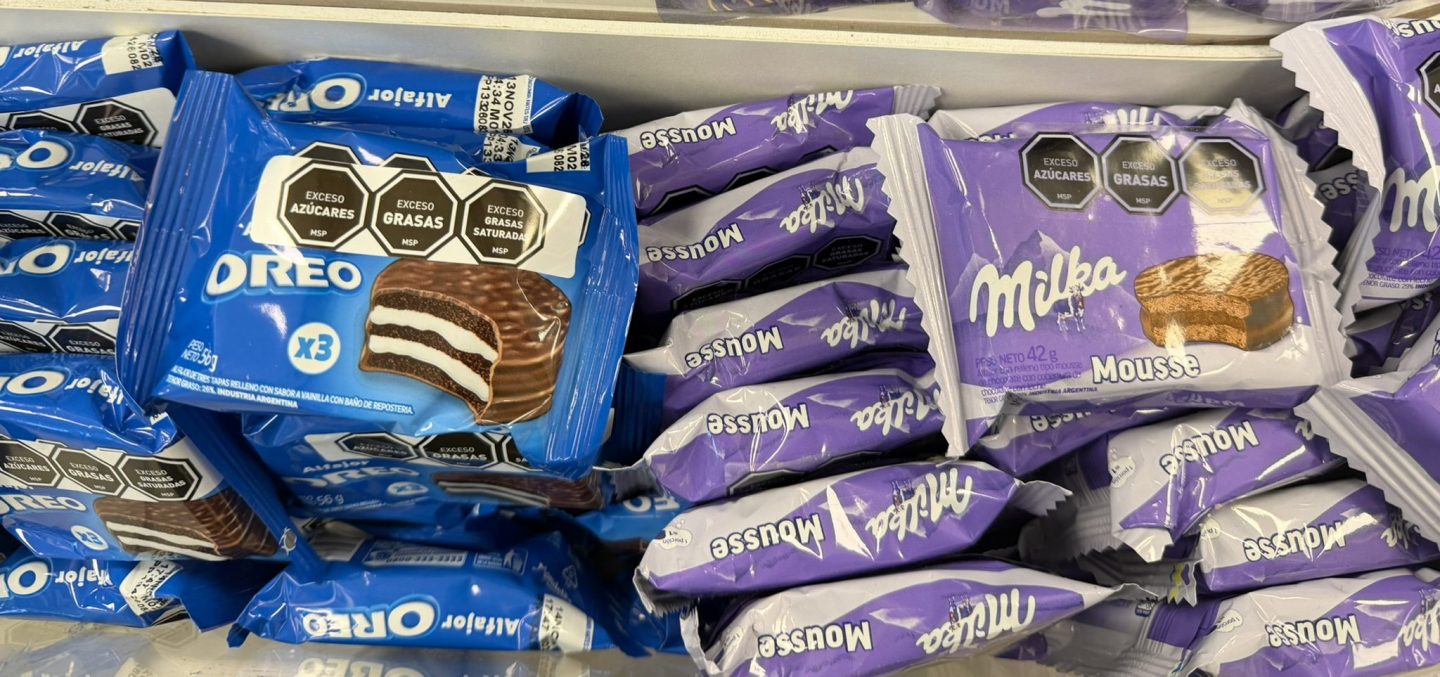 Oreo and Milka alfajores on a shop shelf