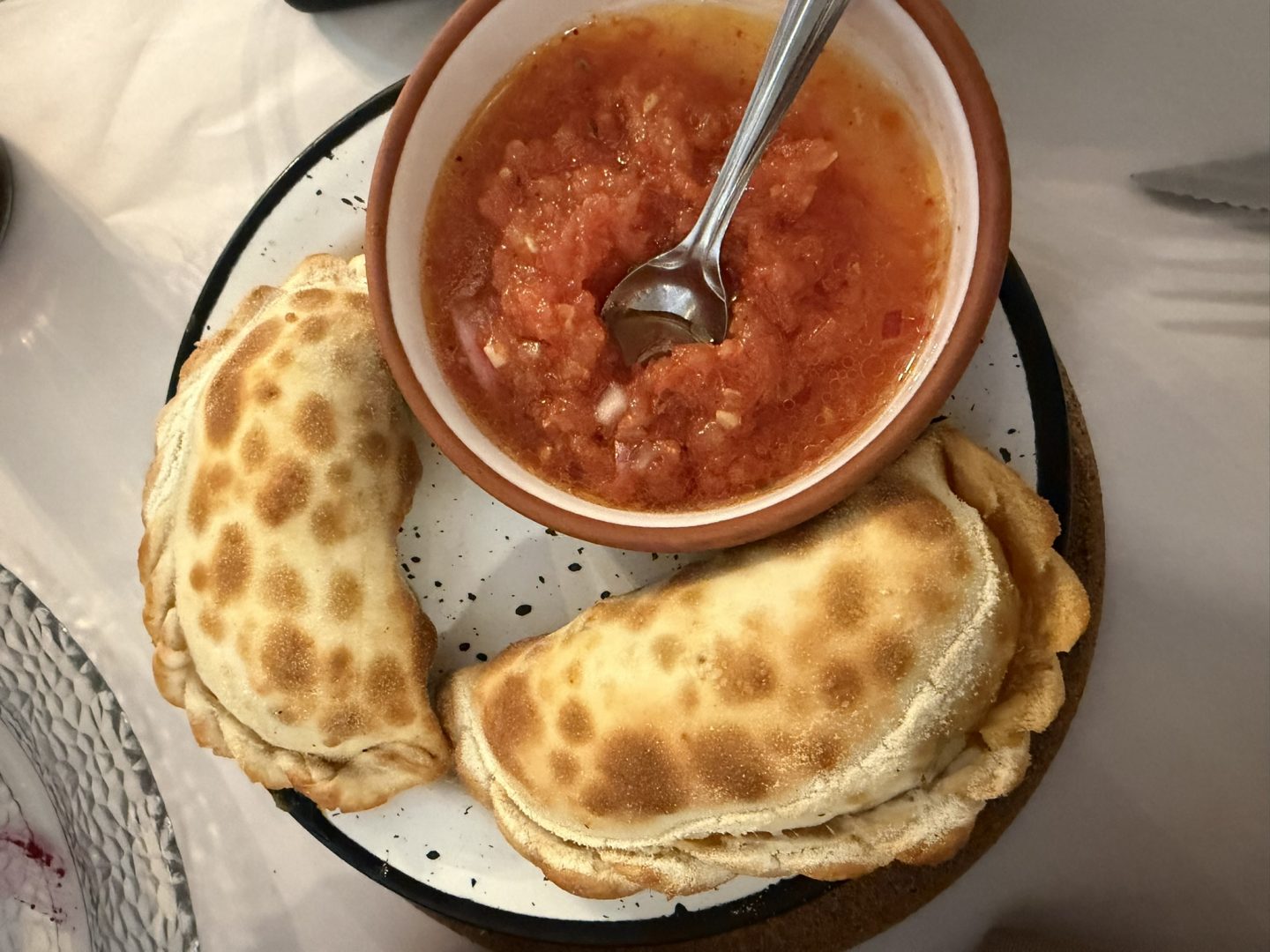 Empanadas served with tomato salsa in Mendoza