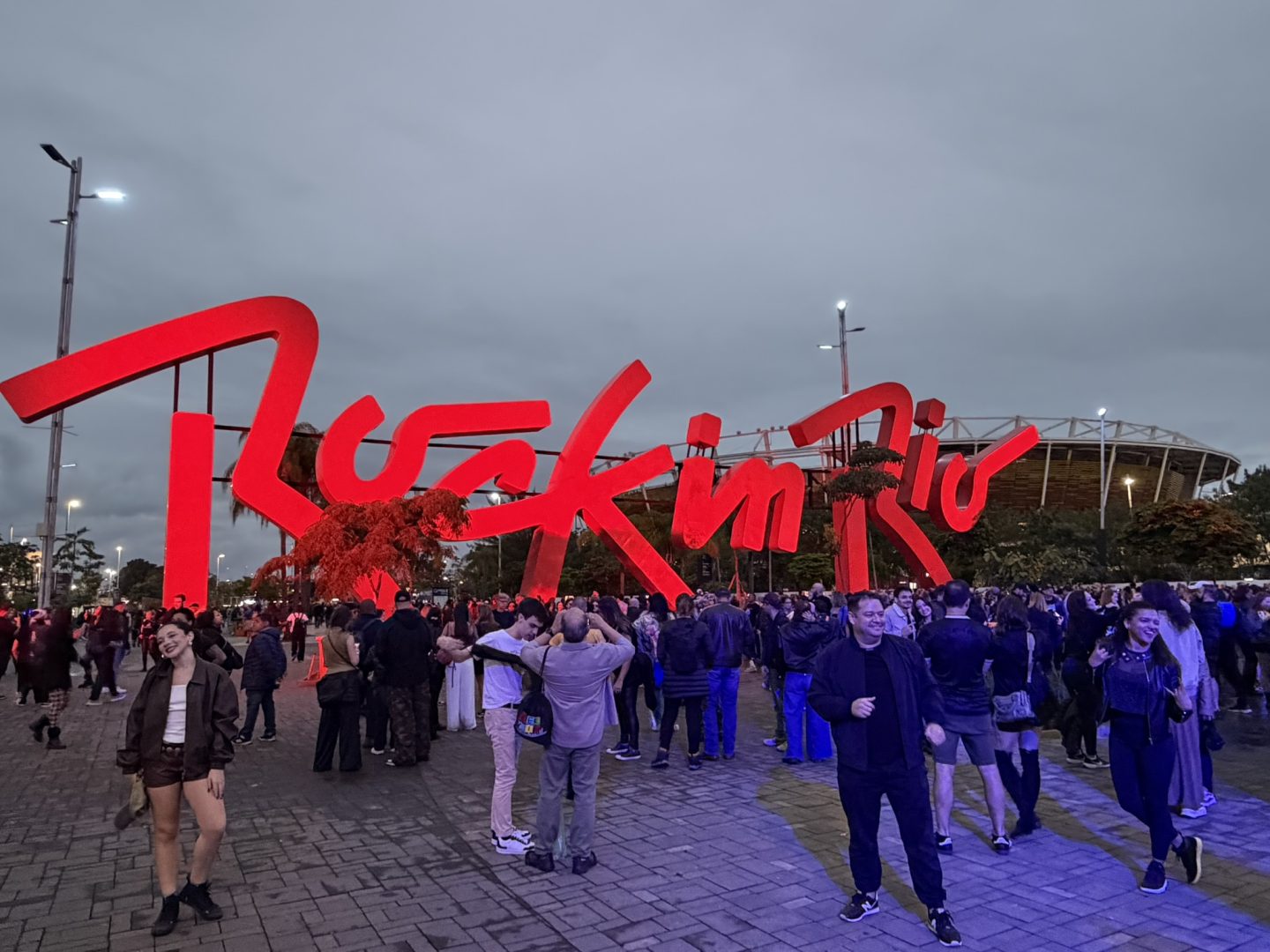 Rock in Rio entrance sign with festival crowds in Rio de Janeiro