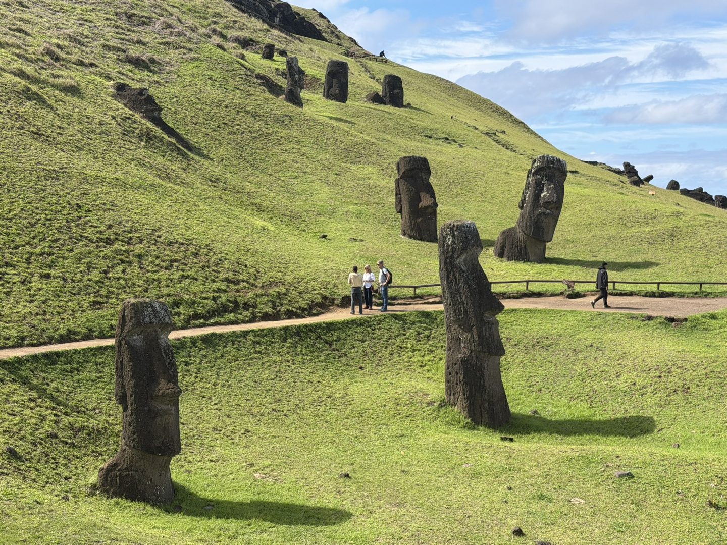 Moai scattered across the slopes of Rano Raraku quarry on Rapa Nui