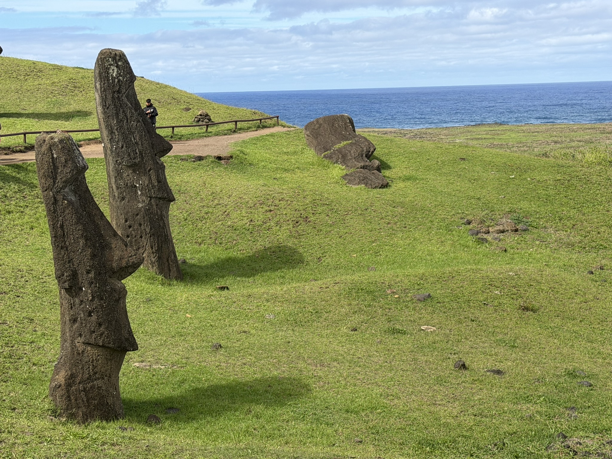 Moai scattered across the slopes of Rano Raraku quarry on Rapa Nui