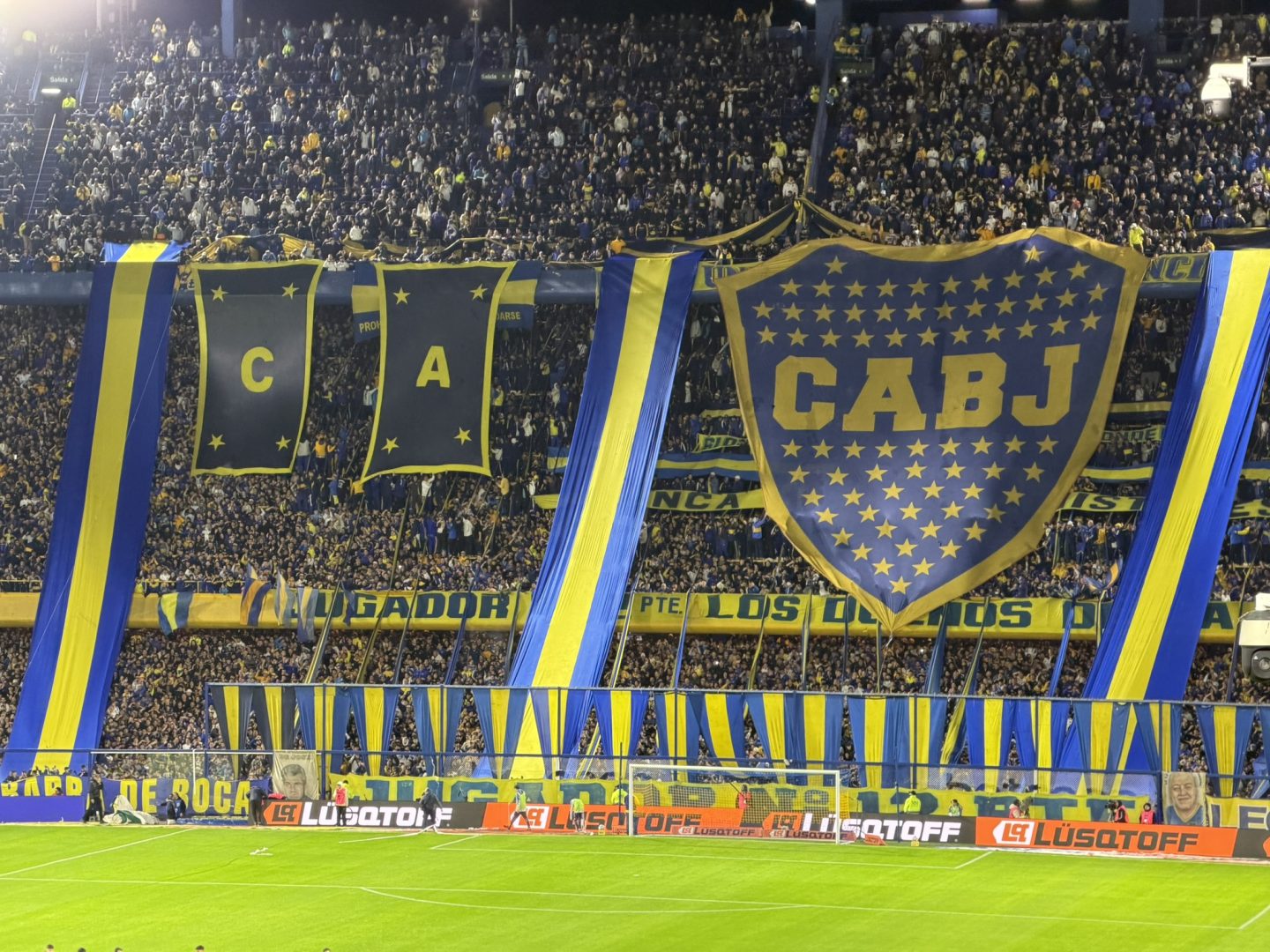 Boca Juniors fans and blue-and-yellow banners during a match at La Bombonera