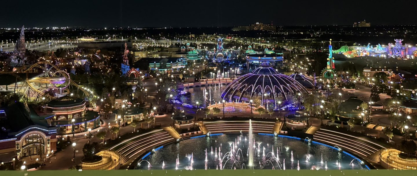 Nighttime view of Celestial Park at Epic Universe from Universal Helios Grand Hotel